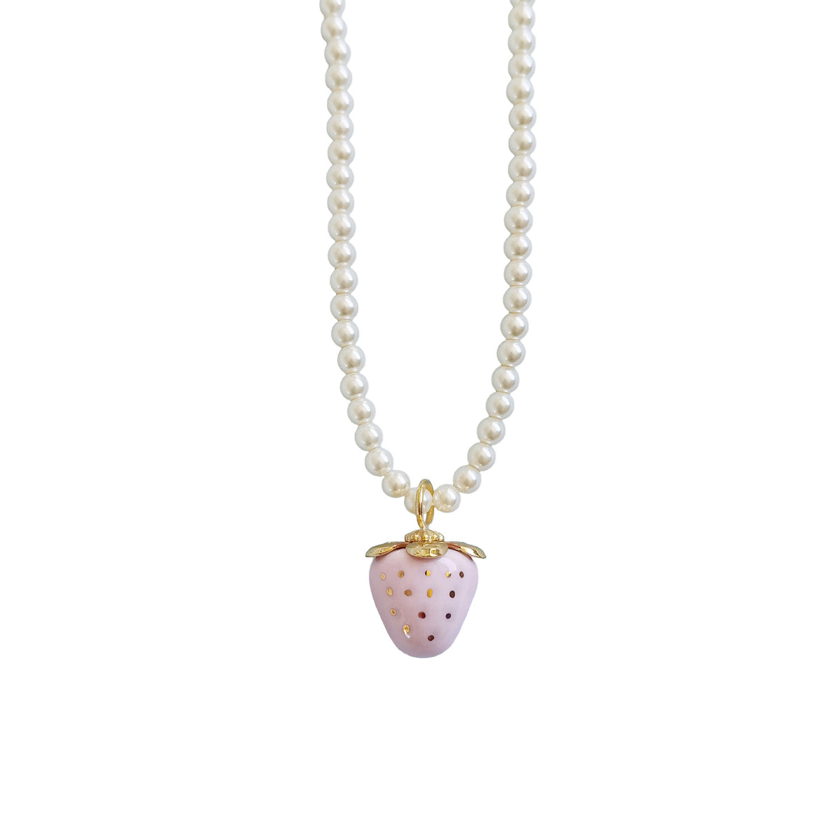 Mini pale pink porcelain strawberry pendant with hand-painted gold dots on a Swarovski glass pearl necklace.